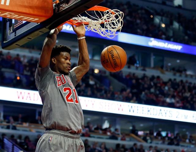 Jan 5, 2016; Chicago, IL, USA; Chicago Bulls guard Jimmy Butler (21) dunks the ball against the Milwaukee Bucks during the first half at United Center. Mandatory Credit: Kamil Krzaczynski-USA TODAY Sports