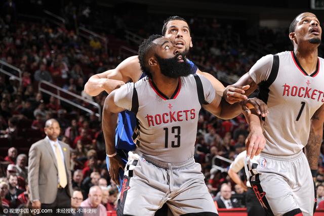 HOUSTON, TX - JANUARY 24: James Harden #13 of the Houston Rockets boxes out against Salah Mejri #50 of the Dallas Mavericks during the game on January 24, 2016 at the Toyota Center in Houston, Texas. NOTE TO USER: User expressly acknowledges and agrees that, by downloading and or using this photograph, User is consenting to the terms and conditions of the Getty Images License Agreement. Mandatory Copyright Notice: Copyright 2016 NBAE (Photo by Bill Baptist/NBAE via Getty Images)