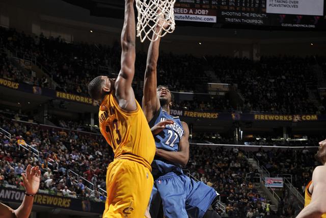 CLEVELAND, OH - JANUARY 25: Andrew Wiggins #22 of the Minnesota Timberwolves goes for the lay up against Tristan Thompson #13 of the Cleveland Cavaliers during the game on January 25, 2016 at Quicken Loans Arena in Cleveland, Ohio. NOTE TO USER: User expressly acknowledges and agrees that, by downloading and or using this Photograph, user is consenting to the terms and conditions of the Getty Images License Agreement. Mandatory Copyright Notice: Copyright 2016 NBAE (Photo by David Liam Kyle/NBAE via Getty Images)