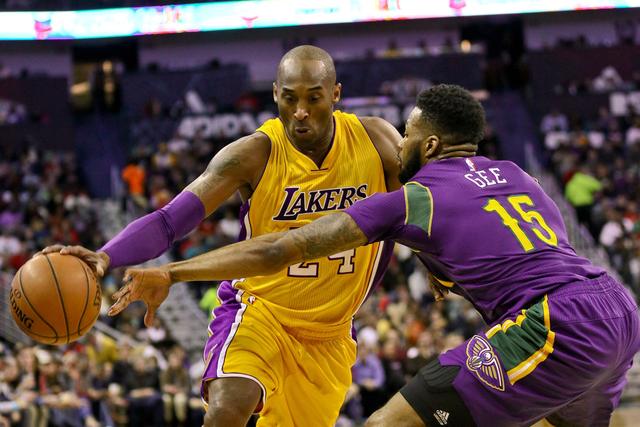 Feb 4, 2016; New Orleans, LA, USA; Los Angeles Lakers forward Kobe Bryant (24) drives past New Orleans Pelicans forward Alonzo Gee (15) during the first quarter of a game at the Smoothie King Center. Mandatory Credit: Derick E. Hingle-USA TODAY Sports