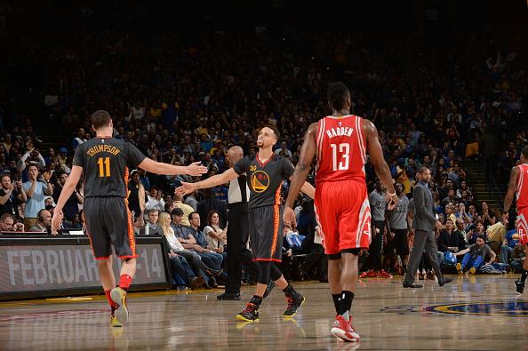 OAKLAND, CA - FEBRUARY 9:  Stephen Curry #30 of the Golden State Warriors high fives Klay Thompson #11 of the Golden State Warriors during the game against the Houston Rockets on February 9, 2016 at Oracle Arena in Oakland, California. NOTE TO USER: User expressly acknowledges and agrees that, by downloading and or using this photograph, user is consenting to the terms and conditions of Getty Images License Agreement. Mandatory Copyright Notice: Copyright 2016 NBAE (Photo by Noah Graham/NBAE via Getty Images)