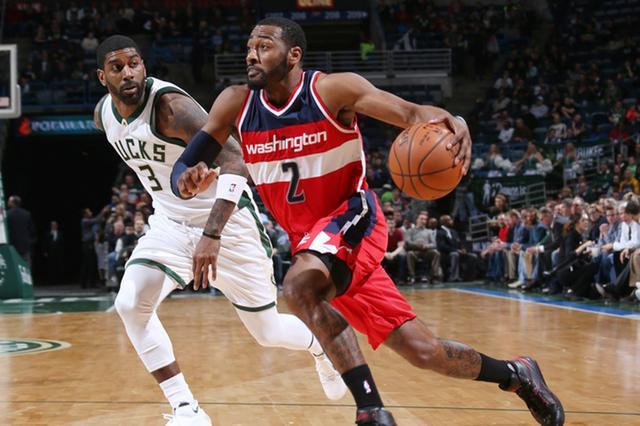 Milwaukee, WI - FEBRUARY 11:  John Wall #2 of the Washington Wizards drives to the basket against O.J. Mayo #3 of the Milwaukee Bucks on February 11, 2016 at the BMO Harris Bradley Center in Milwaukee, Wisconsin. NOTE TO USER: User expressly acknowledges and agrees that, by downloading and or using this Photograph, user is consenting to the terms and conditions of the Getty Images License Agreement. Mandatory Copyright Notice: Copyright 2016 NBAE (Photo by Gary Dineen/NBAE via Getty Images)