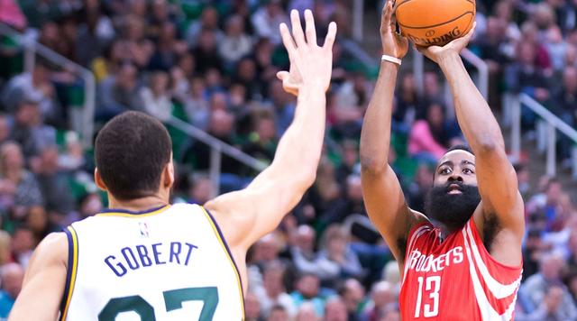 Feb 23, 2016; Salt Lake City, UT, USA; Houston Rockets guard James Harden (13) shoots the ball against Utah Jazz center Rudy Gobert (27) during the first half at Vivint Smart Home Arena. Mandatory Credit: Russ Isabella-USA TODAY Sports