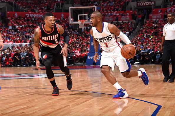 LOS ANGELES, CA - APRIL 20: Chris Paul #3 of the Los Angeles Clippers handles the ball during the game against Damian Lillard #0 of the Portland Trail Blazers in Game Two of the Western Conference Quarterfinals during the 2016 NBA Playoffs on April 20, 2016 at STAPLES Center in Los Angeles, California. NOTE TO USER: User expressly acknowledges and agrees that, by downloading and/or using this Photograph, user is consenting to the terms and conditions of the Getty Images License Agreement. Mandatory Copyright Notice: Copyright 2016 NBAE (Photo by Andrew D. Bernstein/NBAE via Getty Images)